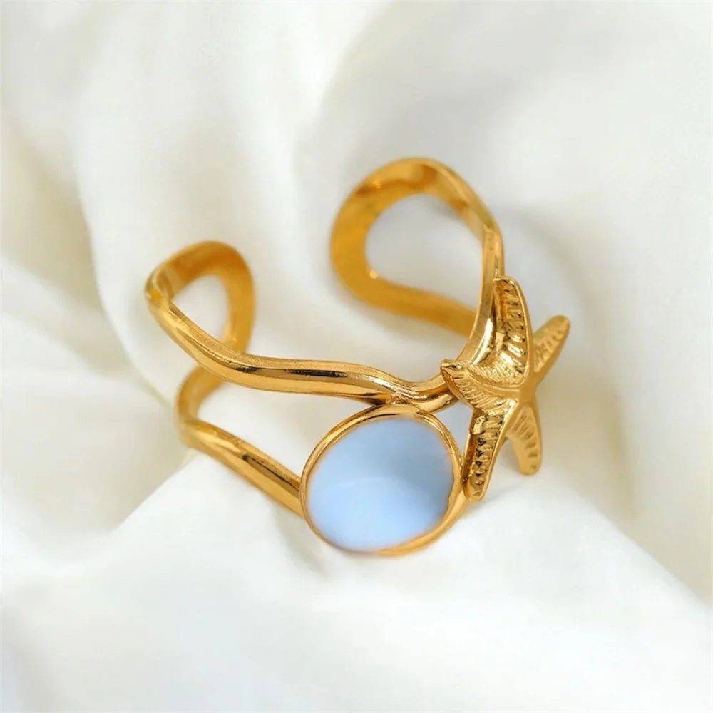 Gold Starfish Ring with Light Blue Accent